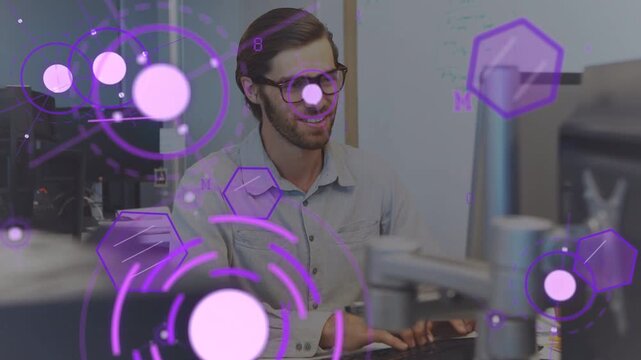 Tech dev working typing causing purple overlays drifting before him while smiling laughing focusing