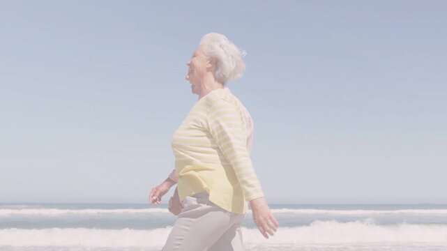 Senior couple walking shore clear sky urging health walk camera tightening glitch bands overlaying