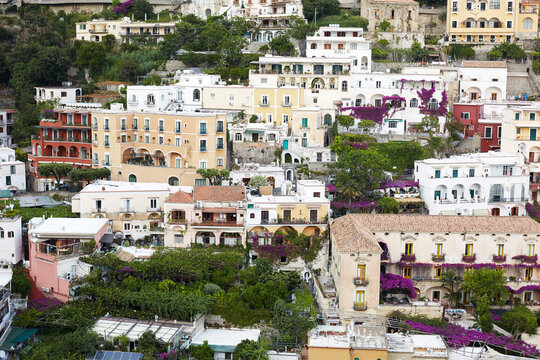 Amalfi cliffside village with colorful houses and bougainvillea