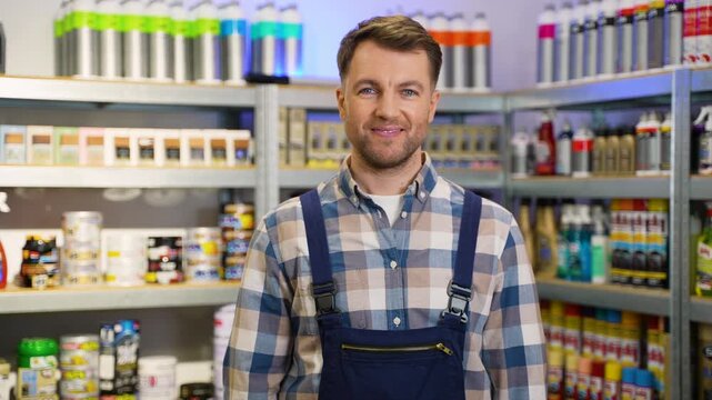 Positive hardware store worker giving thumbs up