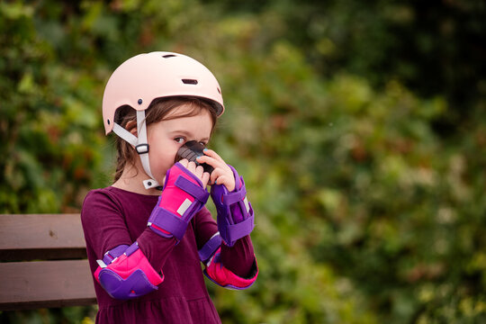 Young girl taking a break from roller skating