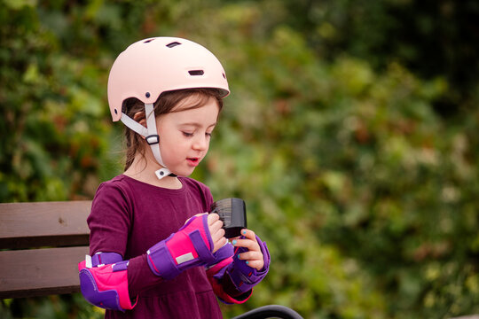 Young girl taking a break from roller skating