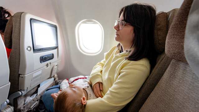 Mother and baby during a peaceful flight journey