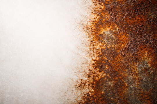 Rusty metal surface with a light background. Space for text.