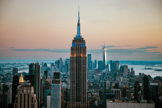 Skyline view of New York City at sunset with iconic buildings