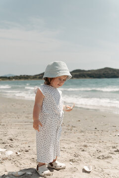 Little girl enjoying a sunny day at the beach