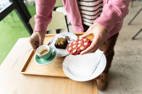 Coffee time with espresso and cookie served on cafe tray