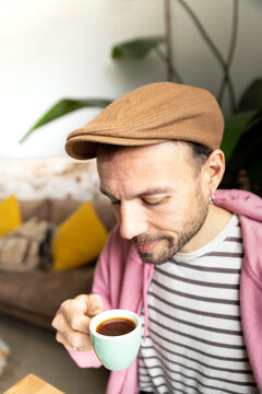 Man enjoying coffee time in cozy cafe with cappuccino