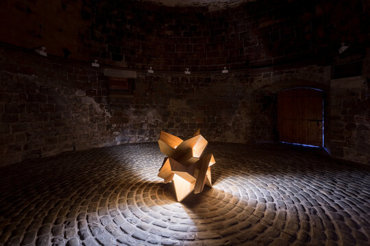 Contemporary wooden sculpture in rustic setting