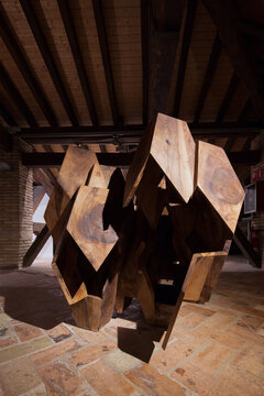 Contemporary abstract wood sculpture in rustic setting