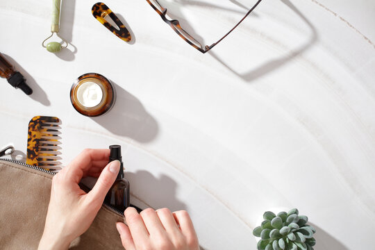Morning skincare ritual with cosmetic essentials and pouch