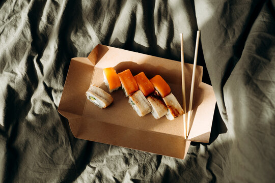 Sushi platter on bed during a relaxing day off at home