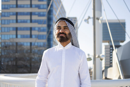 Arab businessman sheikh in city, Confident outdoor portrait