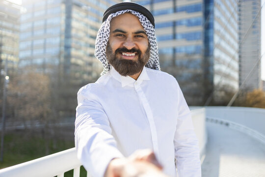 Arab businessman sheikh offering handshake