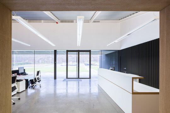Modern candy factory reception area with office workspace