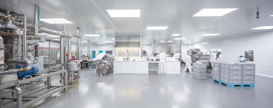 Modern candy laboratory and factory interior with workers