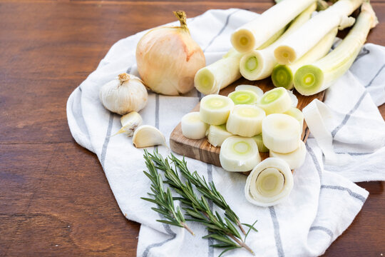 Fresh sliced leek with garlic and rosemary on kitchen towel