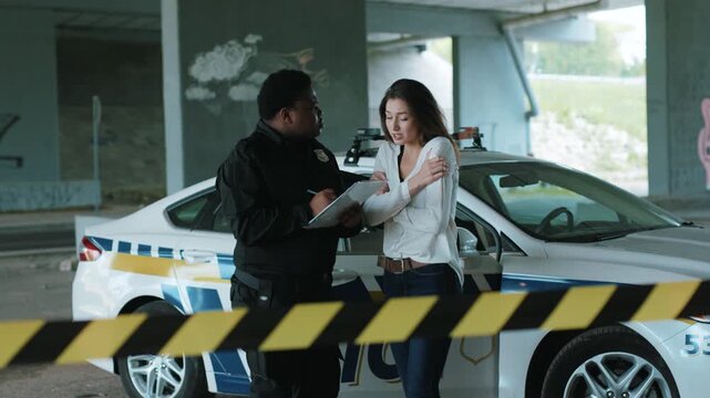 African american policeman interrogates a woman in an incident arrest criminal enforcement burglar man officer black bad robbery business busted , illegal close up slow motion