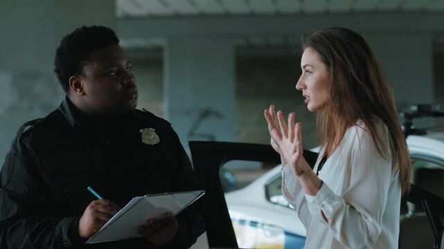An Officer Engaging in a Focused Interaction with a Driver in a Designated Parking Area
