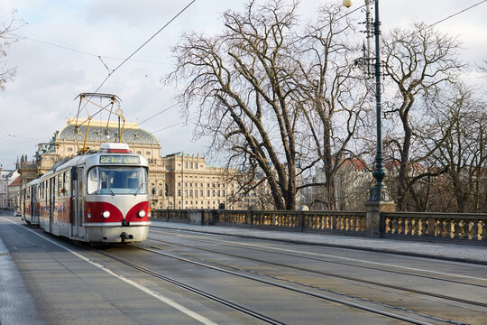 Prague city tram near historic theater and architecture