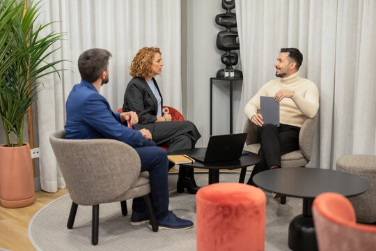 Business team meeting in modern coworking lounge space