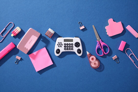 Pop art school supply flat lay with calculator gamepad