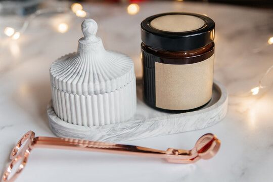 Minimalist plaster tray with soy candle and casket decor