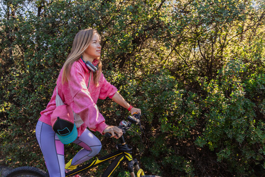 Woman enjoying a peaceful bicycle ride in the park
