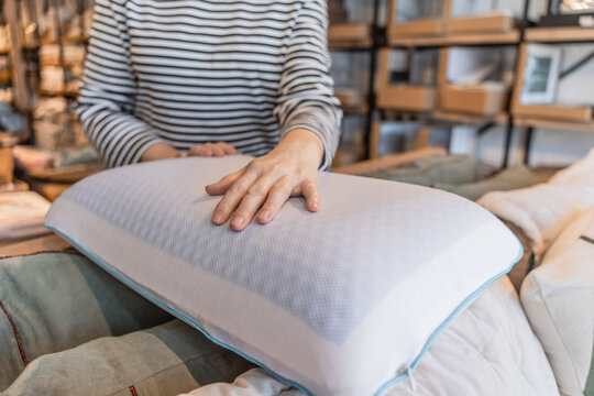 Woman shopping for soft textiles in a home store