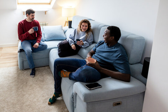 Friends enjoying coffee and conversation at home