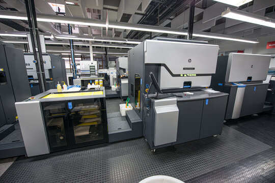 Gothenburg, Sweden - February 13 2013: Modern industrial printing facility with advanced digital press machines in production environment.