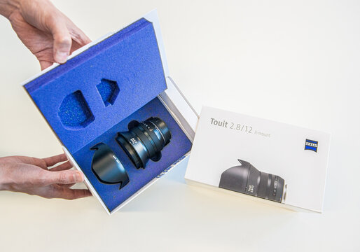 Gothenburg, Sweden - June 03 2013: Unboxing of Zeiss Touit 12mm camera lens with packaging and protective case.