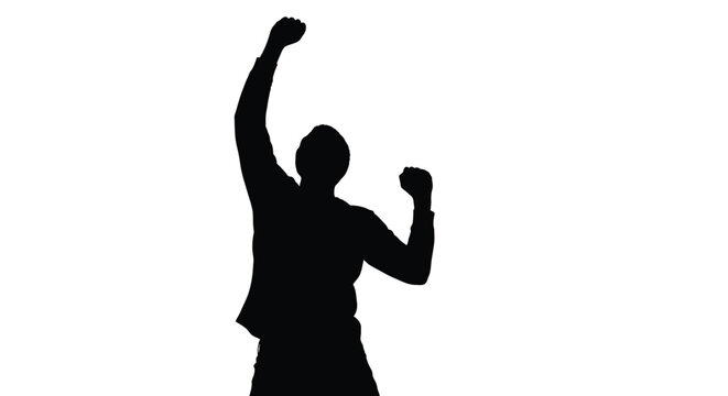 Silhouette of a victorious man celebrating with a raised fist in triumph and success