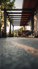 Fototapeta premium Relaxing outdoor patio with wooden pergola and comfortable seating surrounded by greenery on a sunny day in a peaceful natural setting