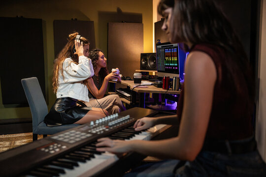 Music producer and artist working in a recording studio