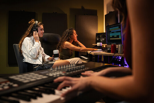 Music producer and artist working in modern recording studio