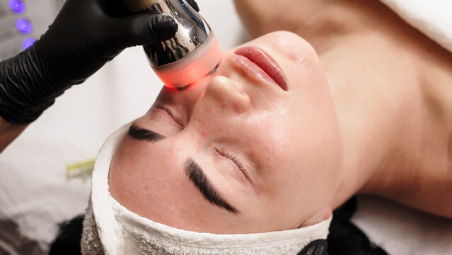 Professional RF lifting session in modern aesthetic clinic. Concept.
