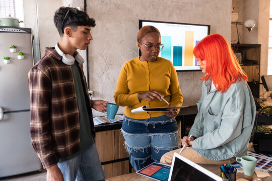 Diverse team discussing startup strategy in modern office