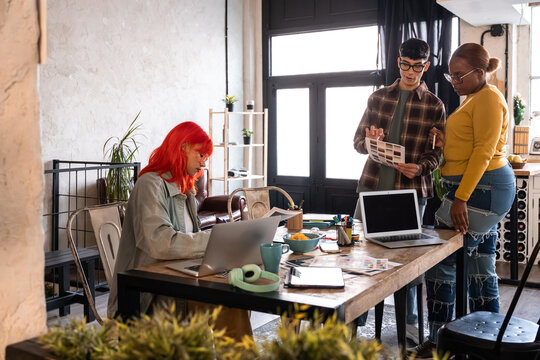 Coworkers planning a project in a modern creative office