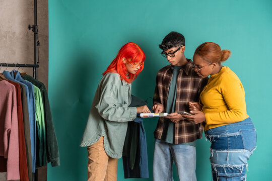 Diverse team reviewing color swatches for fashion collection