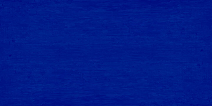 A dark blue denim fabric texture with a rough vintage canvas pattern and grunge material surface design for a textile background wallpaper