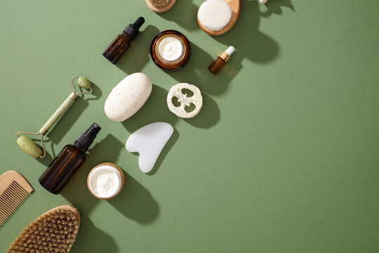 Eco-friendly skincare products on green background