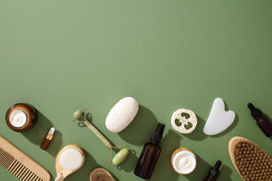 Eco-friendly natural skincare products on green background