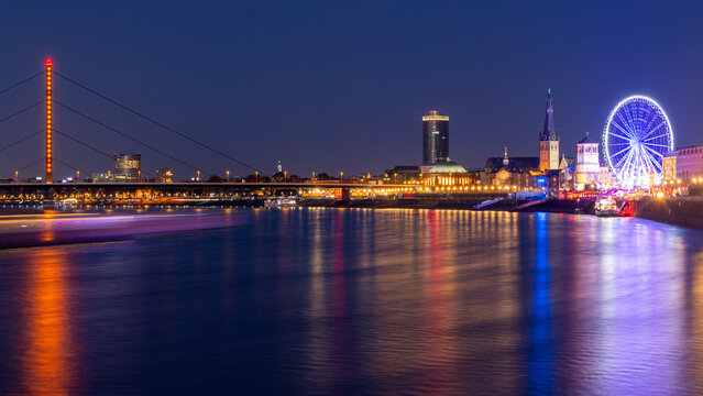 Night skyline of Dusseldorf on Rhine with ferris wheel