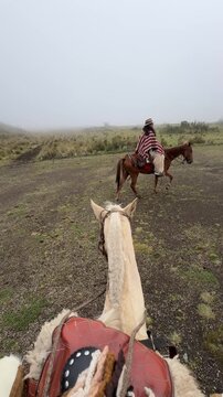 Horseback riding in misty Andes near Riobamba, Ecuador