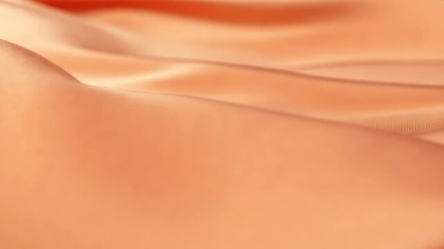 This features a close-up shot of orange fabric with a smooth, flowing texture and gentle folds. The vibrant color and luxurious material are showcased in a visually appealing way, highlighting the