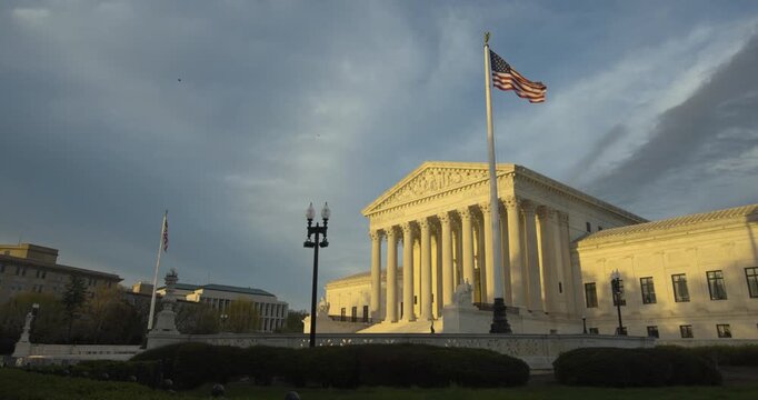 US Supreme Court with American Flag Waving