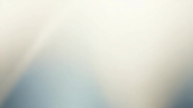Soft abstract gradient blurred background with soft blue cream tones gentle glow calm mood