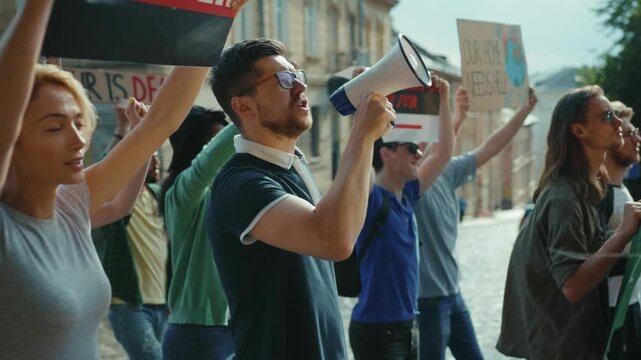 Youth Activism during Protest with Loud Megaphone to Amplify Their Voices and Message
