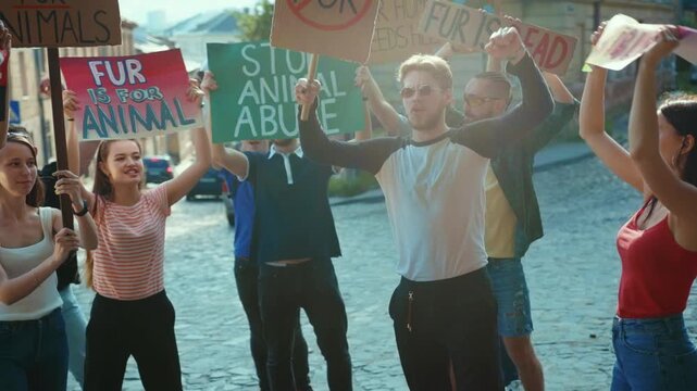 A vibrant crowd passionately protesting for meaningful change within an urban environment